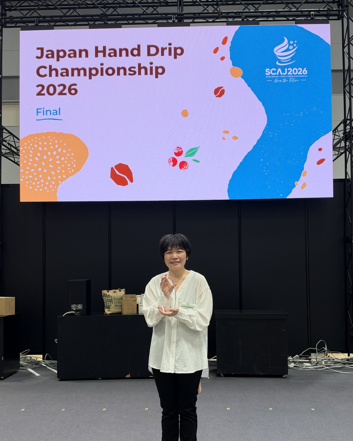 Chikako Nitta holding the trophy after the JHDC 2026 awards ceremony